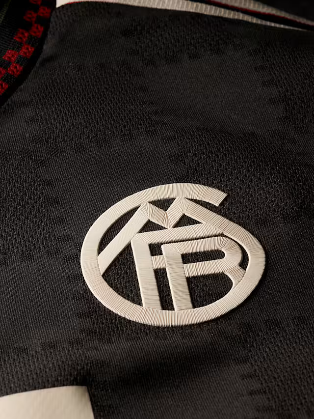 Bayern Munich Kane 3rd Kit 2025/26 (Champions League) – red and striped and black retro football jersey detail view