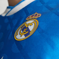 Real Madrid Mbappe 3rd Kit 2025/26 (Champions League) – white and blue and geometric retro football jersey detail view