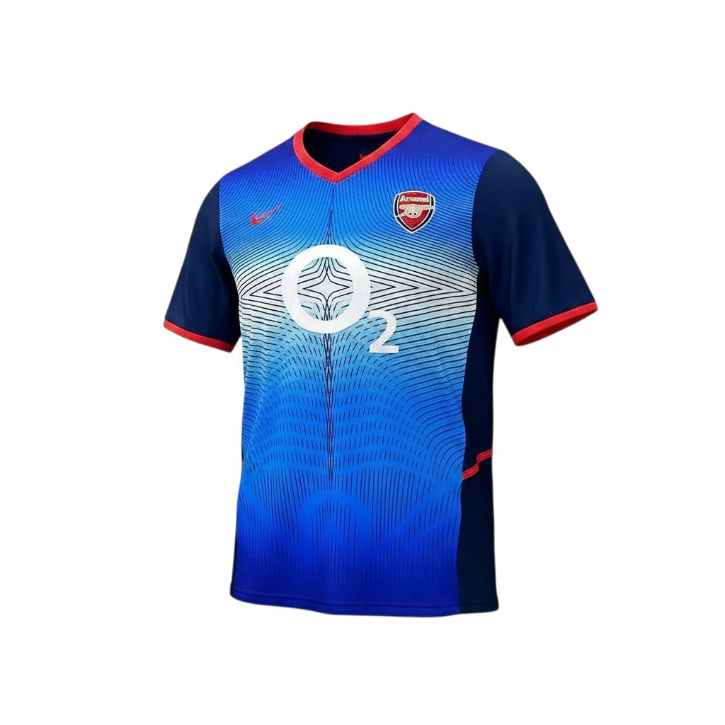 Archive Football Arsenal 2002/03 away retro jersey in blue with red trim, embroidered crest, and O2 sponsor logo.