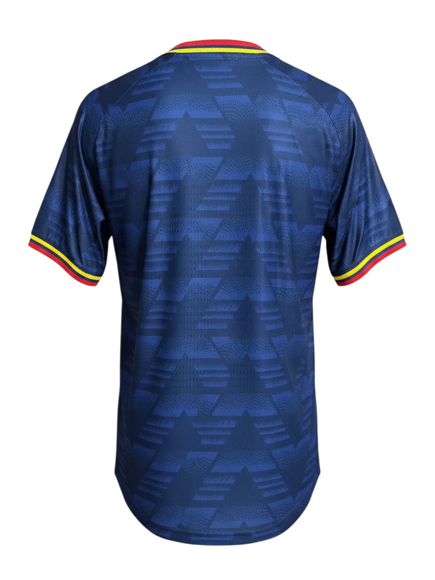 Archive Football Arsenal 2026/2027 away jersey in blue with geometric pattern and red and yellow sleeve trim, back view