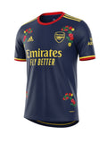 Archive Football Arsenal 2026/2027 away jersey in navy blue with gold accents and floral embroidery details.