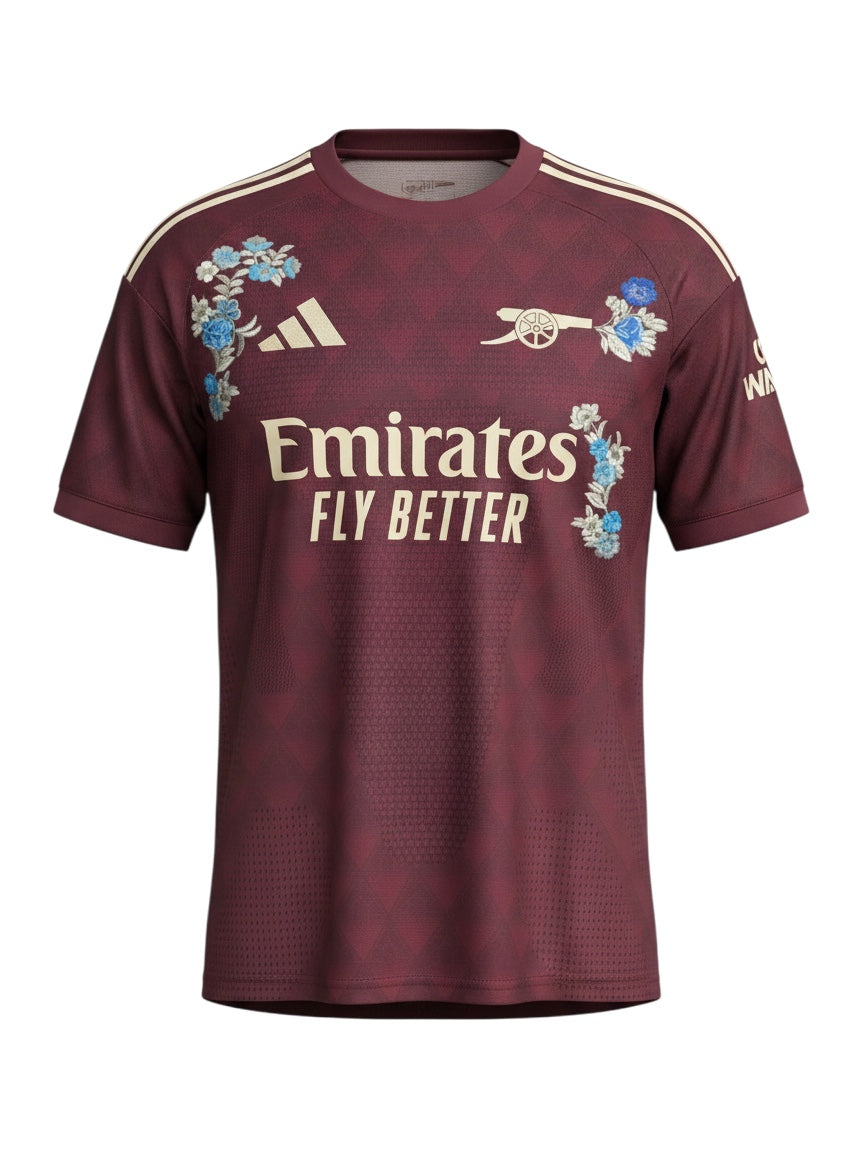 Archive Football Arsenal 2026/27 jersey in maroon with floral embroidery, team emblem, and breathable polyester fabric.