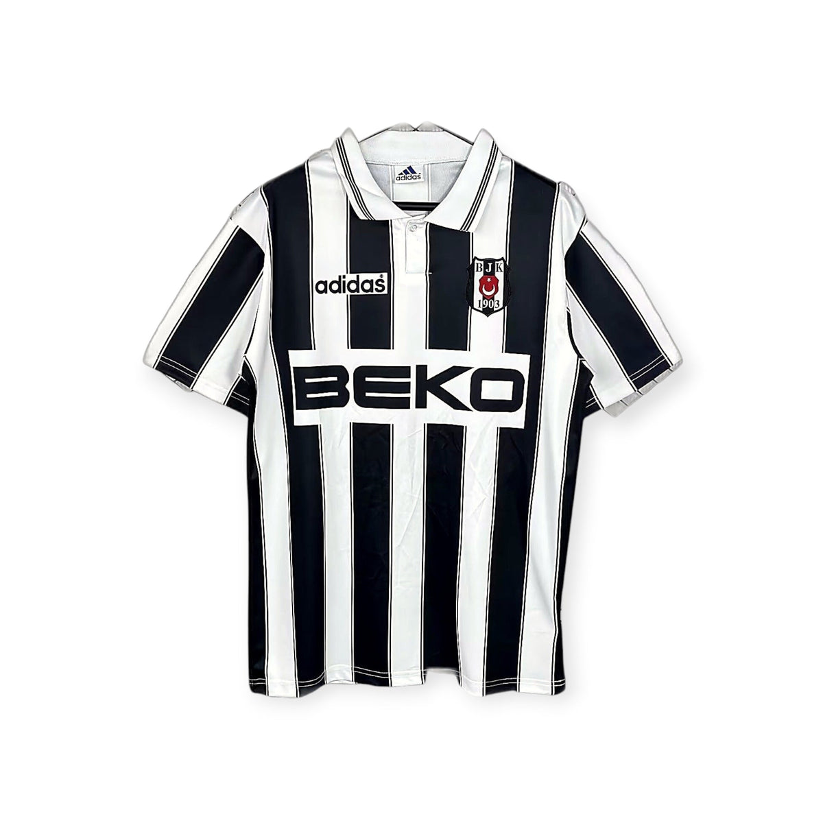 Archive Football Besiktas 1996/97 away retro jersey in black and white stripes with embroidered crest and sponsor logo