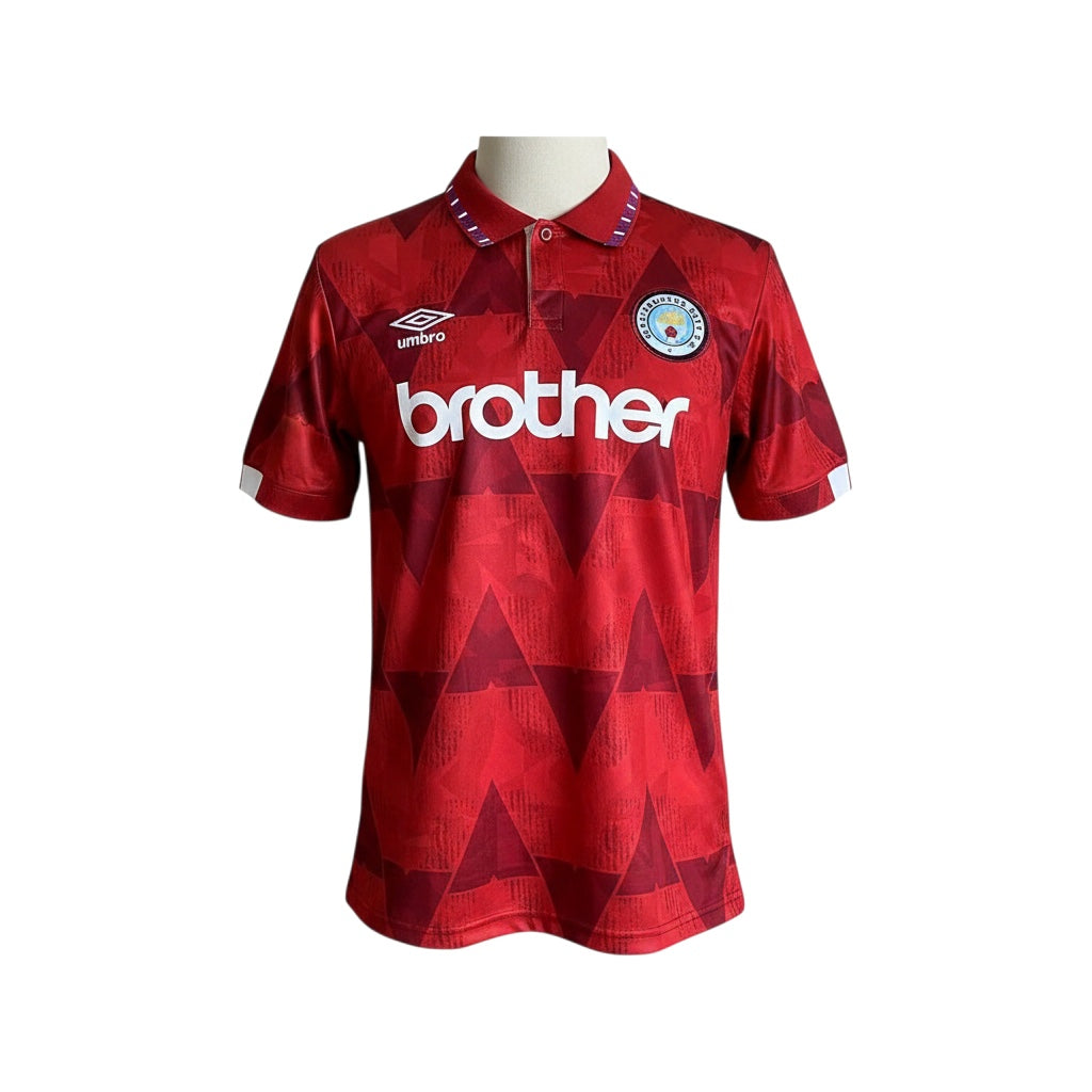 Archive Football Manchester City 1990/92 away retro jersey in red with geometric pattern and embroidered club crest.
