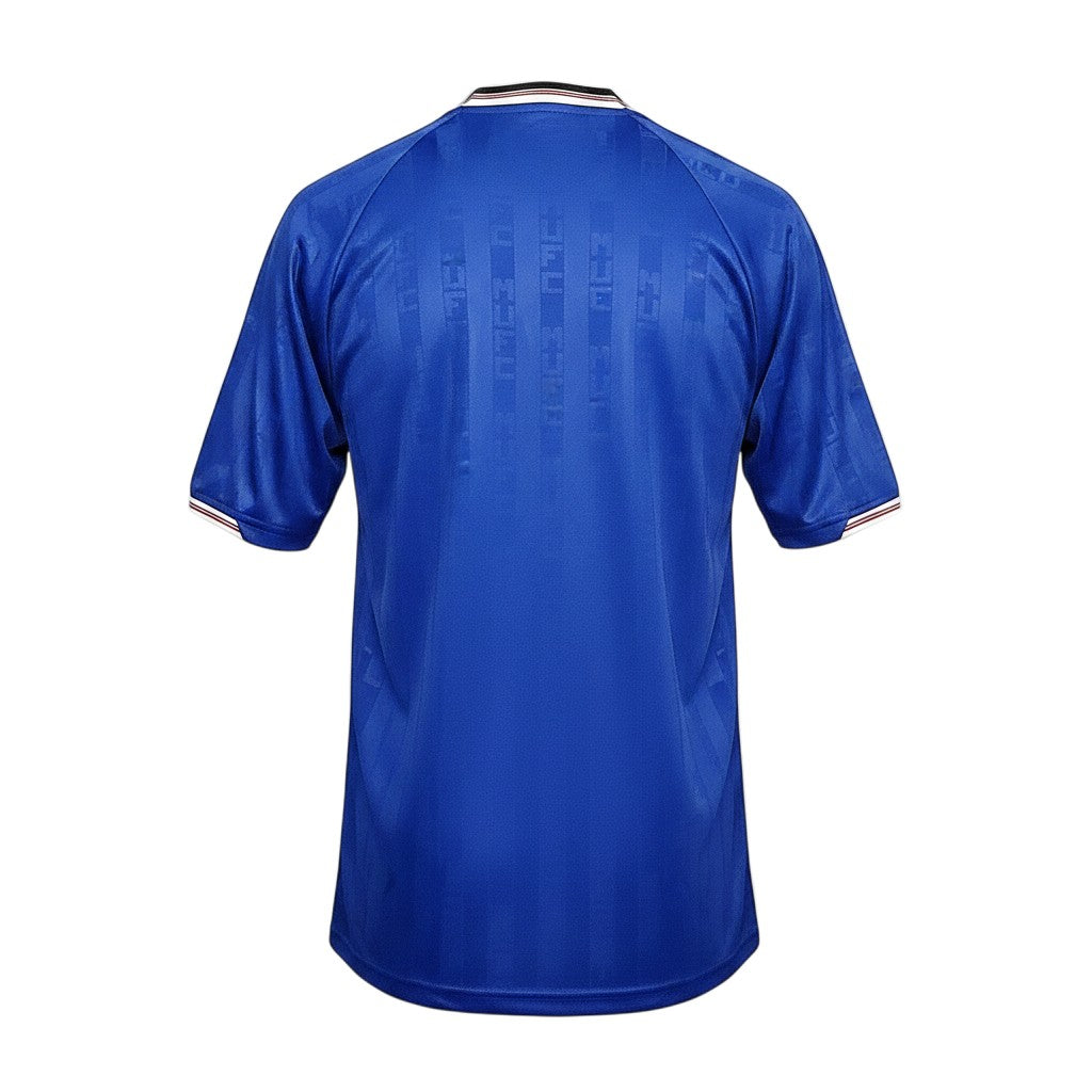 Vista trasera de la camiseta retro Archive Football del Manchester United 1988/89 en color azul con detalles tejidos