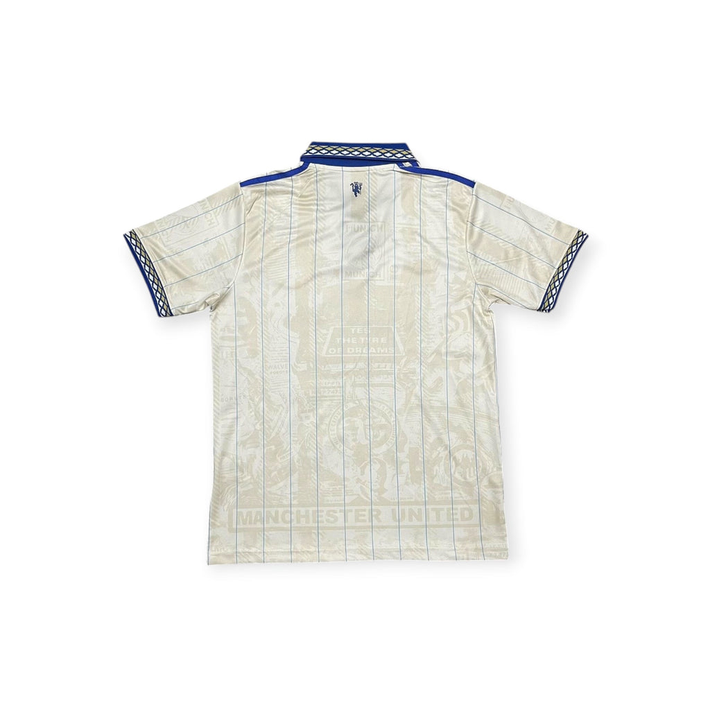 Archive Football Manchester United 2026/2027 special edition jersey back view in cream with blue patterned trim