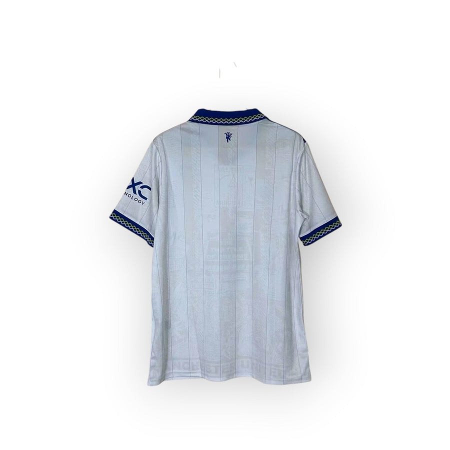 Archive Football Manchester United 2026/27 third jersey back view in white with blue collar and sleeve trim