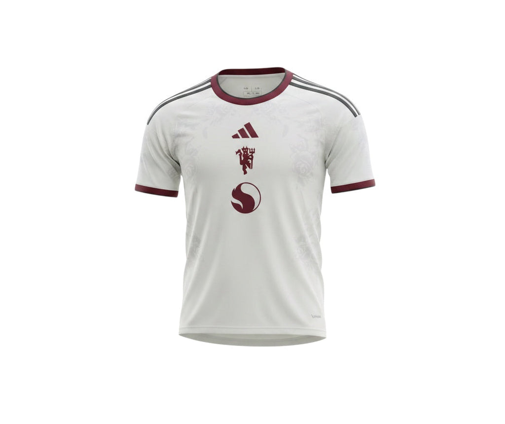 Archive Football Manchester United 2026/2027 third jersey in white with maroon accents and subtle floral pattern.