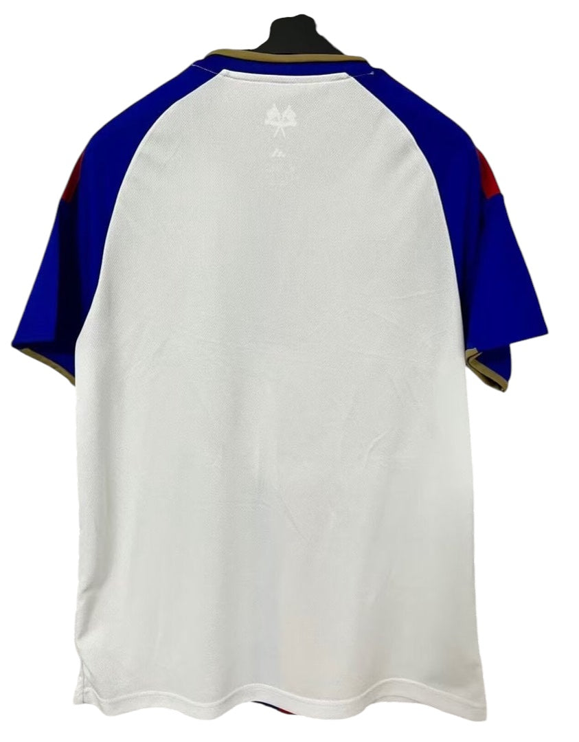 Archive Football Olympique Lyonnais 2026/27 home jersey, white back view with blue sleeves and gold trim.