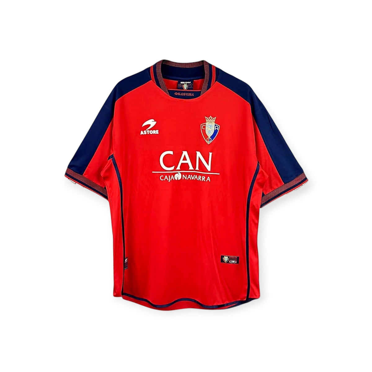 Archive Football Osasuna 2000/01 retro home jersey in red with navy blue accents, embroidered crest and sponsor logo.