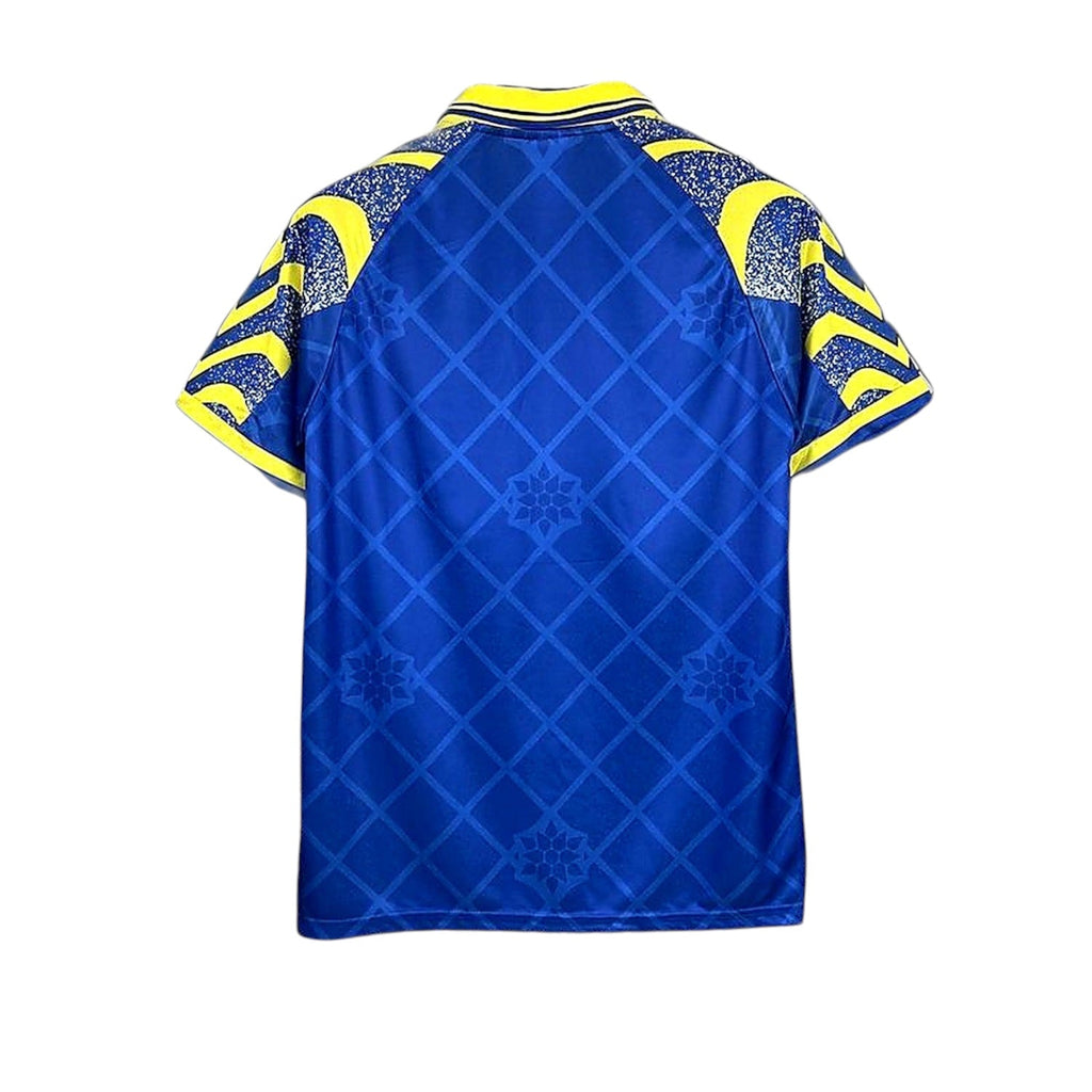 Back view of Archive Football Parma 1995/97 third retro jersey in blue and yellow with a diamond pattern and collar.