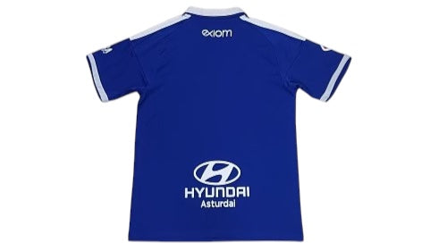 Archive Football Real Oviedo 2026/2027 home jersey in blue with white accents and sponsor logos, back view.