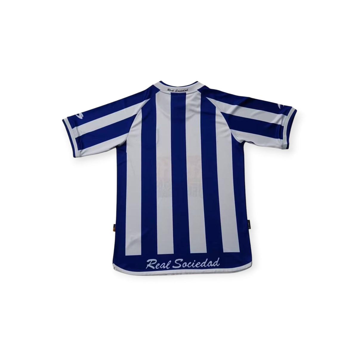 Archive Football Real Sociedad 2002/03 retro home jersey in blue and white vertical stripes, back view