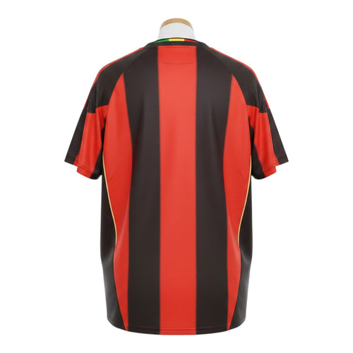 Hinchas Sportswear Store AC Milan 2010-11 retro home jersey, red and black vertical stripes, gold side panels, crew neck.