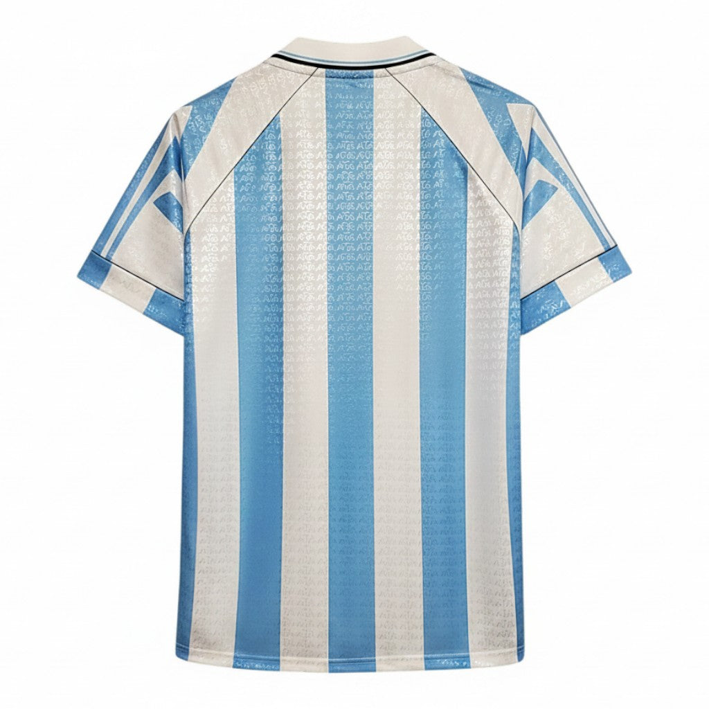 Hinchas Sportswear Store Argentina 1996 retro home jersey, light blue and white vertical stripes, jacquard watermark pattern, polo collar, black piping.
