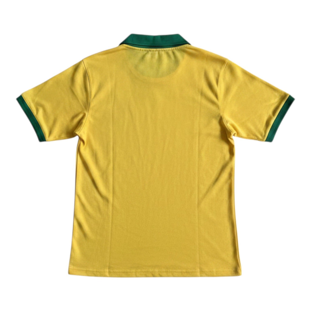 Hinchas Sportswear Store Brazil 1957 retro home jersey in canary yellow with green V-neck collar and sleeve cuffs. Vintage CBD crest.