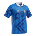 Hinchas Sportswear Store Brazil 1992 away jersey in electric blue with white polo collar, navy chevron details, and CBF jacquard watermark.