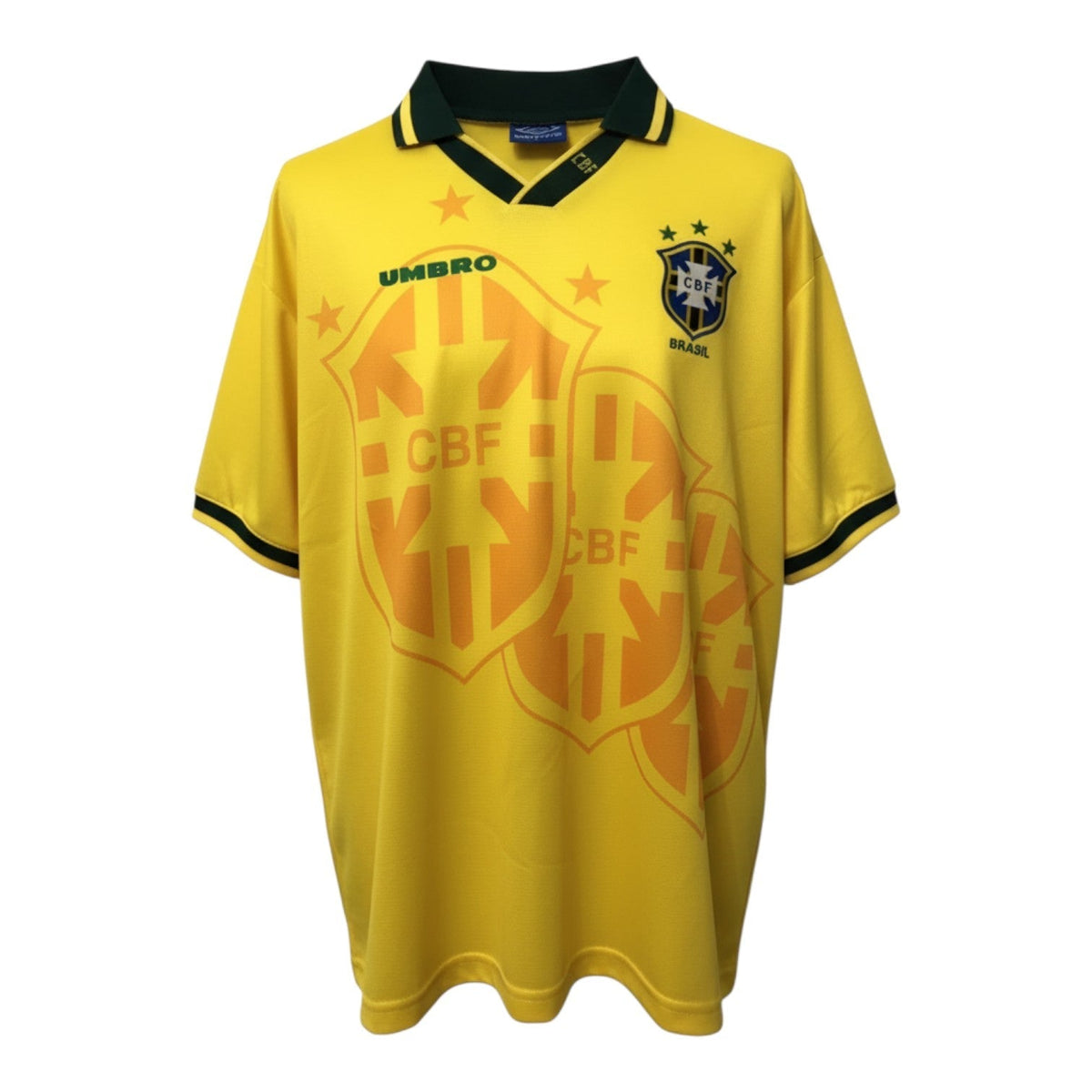 Hinchas Sportswear Store Brazil 1994 retro home jersey in canary yellow with green collar and cuffs, featuring an oversized CBF shield watermark.