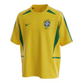 Hinchas Sportswear Store Brazil 2002 World Cup home jersey in yellow with green accents, featuring the iconic CBF crest and Nike swoosh.