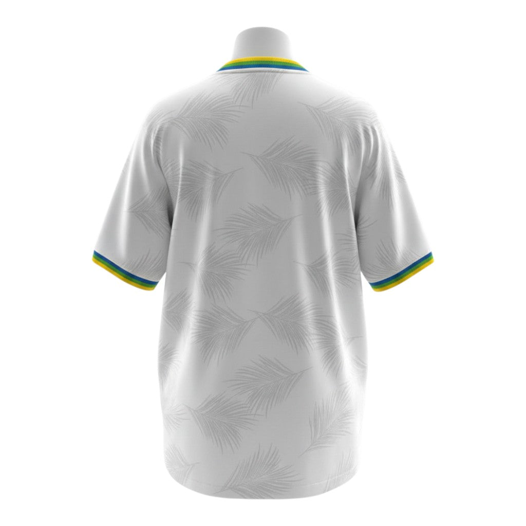 Hinchas Sportswear Store white Brazil away jersey with palm leaf pattern, featuring tricolor collar and cuffs.