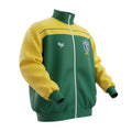 Hinchas Sportswear Store Brazil 1982 retro track jacket in green and yellow colorblock with CBF crest and "BRASIL" lettering.