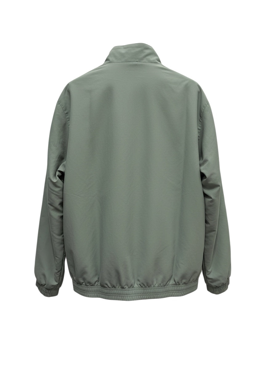 Chaqueta retro de entrenamiento gris plateado de Adidas para Francia de los 90, con cuello alto, cremallera completa y logo de Adidas.