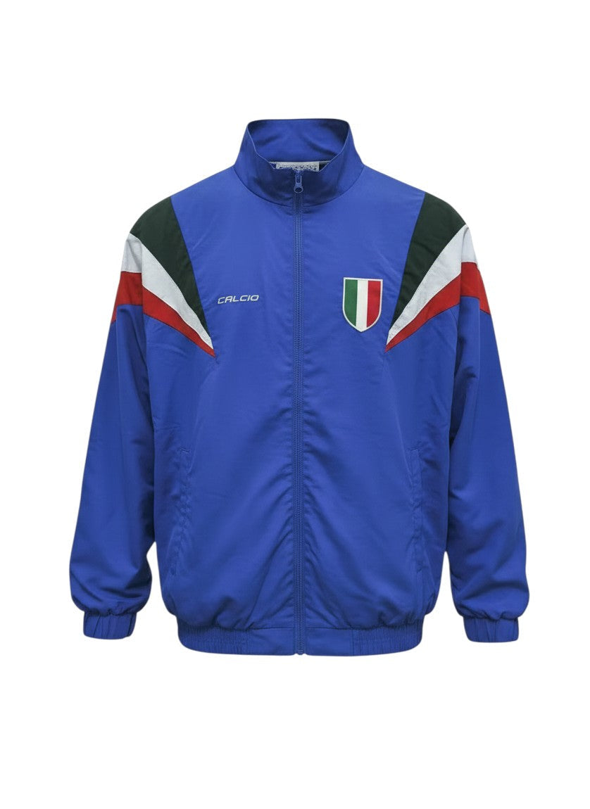 Chaqueta recia retro azul de Hinchas Sportswear Store con paneles diagonales tricolores y escudo de la FIGC.