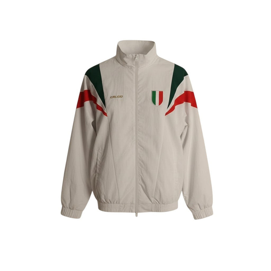 Chaqueta recia blanca de Hinchas Sportswear Store con paneles diagonales tricolores verde, blanco y rojo, escudo de la FIGC y logo de Calcio.