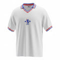Hinchas Sportswear Store white Chelsea 1982 retro football jersey with blue, red, and white striped collar and cuffs, featuring the CFC lion crest.