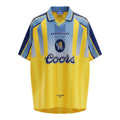 Hinchas Sportswear Store Chelsea FC 1994/96 retro away jersey. Yellow with light blue vertical stripes, navy blue sleeves and collar. Features Umbro logo and Coors sponsor.