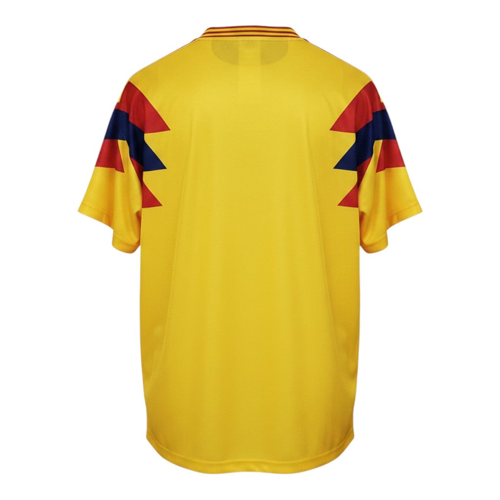 Hinchas Sportswear Store 1990 Colombia Home Jersey: vibrant yellow with red and blue lightning bolt shoulder panels and tricolor collar.