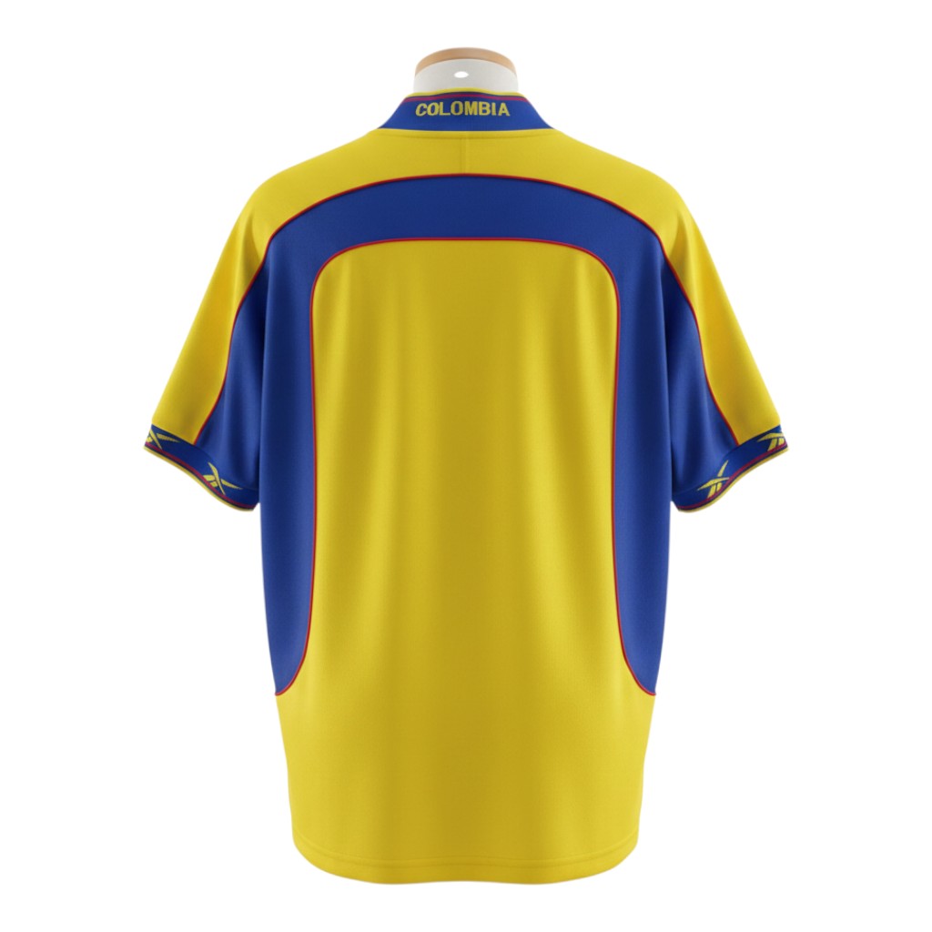 Hinchas Sportswear Store Colombia 2001 home jersey in yellow with blue panels, blue V-neck collar, and Reebok branding.