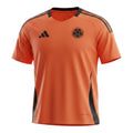 Hinchas Sportswear Store Colombia training jersey 2025 in vibrant orange with black accents, crew neck, and Adidas branding.