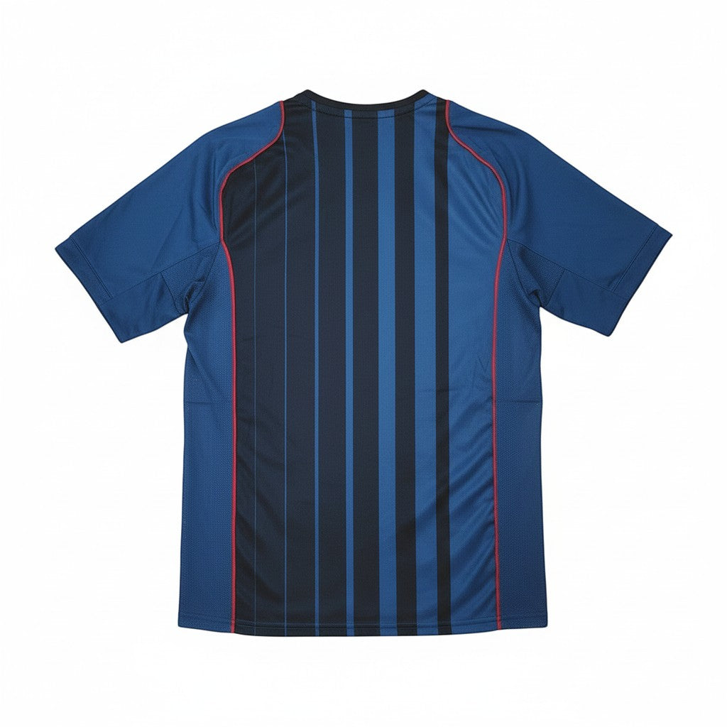 Hinchas Sportswear Store FC Barcelona 2004-05 retro away jersey, navy blue with black vertical stripes and red piping.