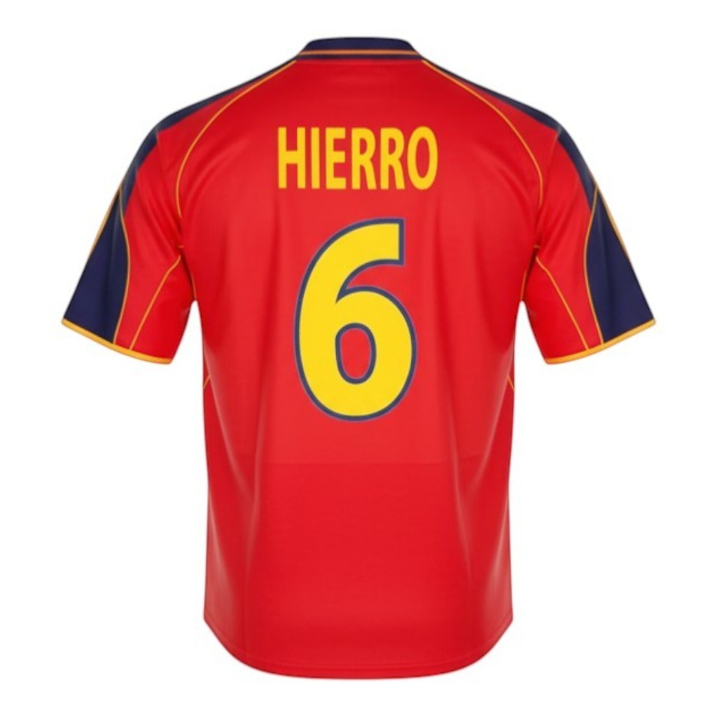 Hinchas Sportswear Store Fernando Hierro Spain retro jersey 1999, red with yellow trim and navy blue accents, number 6 on back.