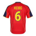Hinchas Sportswear Store Fernando Hierro Spain retro jersey 1999, red with yellow trim and navy blue accents, number 6 on back.