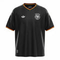 Hinchas Sportswear Store: Black Adidas Originals Germany retro football jersey with white stripes and German flag details on collar and cuffs.