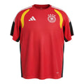 Hinchas Sportswear Store Germany 2026 red, black, and yellow Climacool training jersey with white Adidas stripes on shoulders and DFB crest.