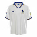 Hinchas Sportswear Store white Italy 1996 Euro away jersey with blue collar and gold trim, Nike logo, FIGC crest, and tournament patches.