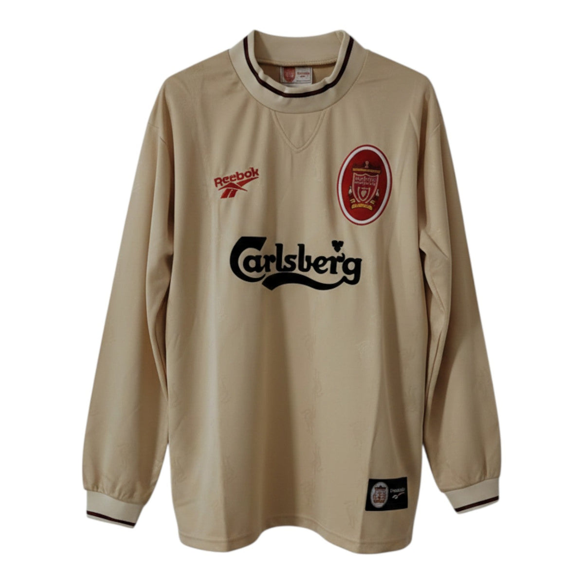 Hinchas Sportswear Store Liverpool FC 1996/97 cream long sleeve retro jersey with red and gold crest and Carlsberg sponsor.