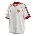 Hinchas Sportswear Store white Manchester United 1991 retro jersey with geometric pattern, red trim, and commemorative badge.