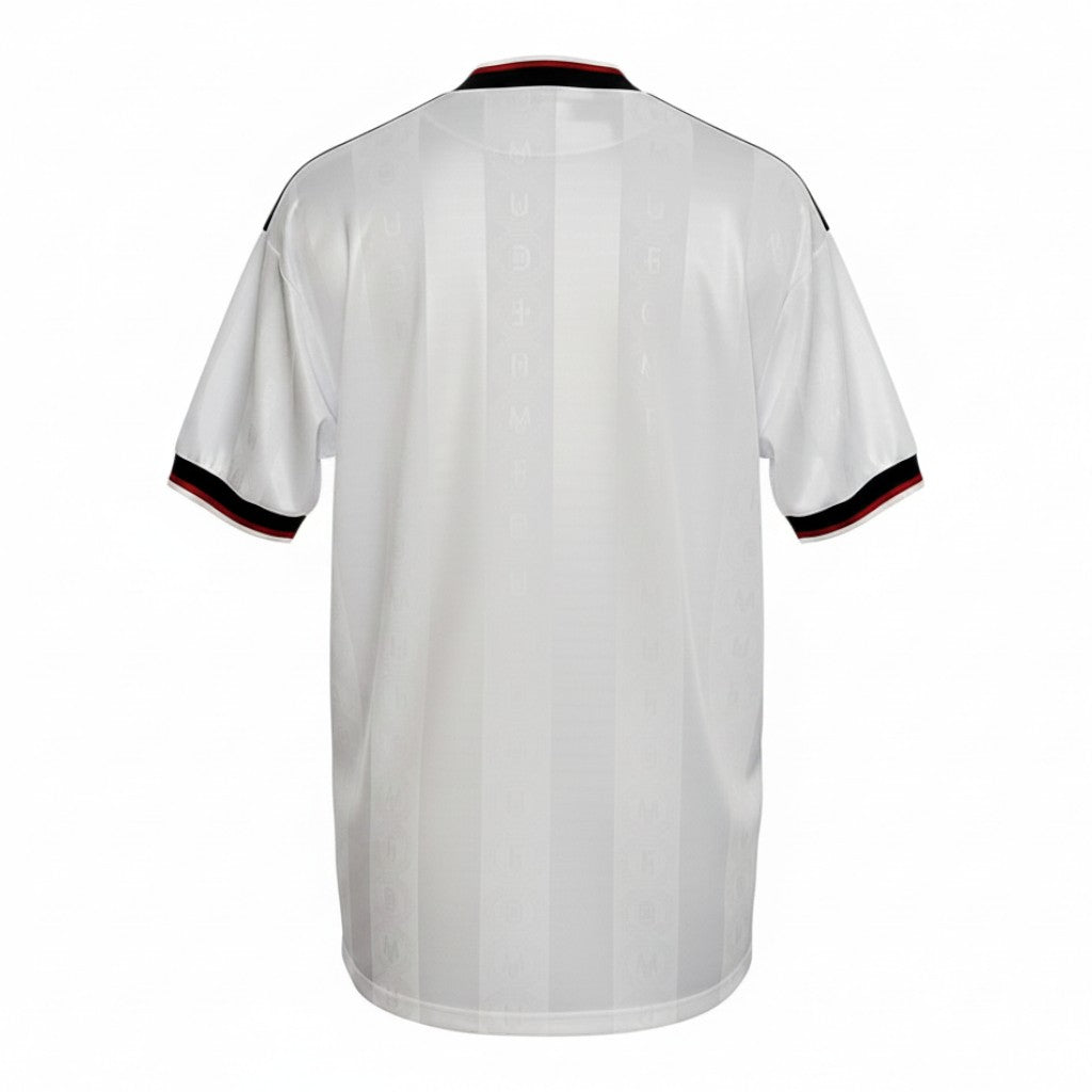 Hinchas Sportswear Store Manchester United 1997-98 away jersey, white with black and red trim, subtle shadow stripe pattern.