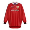 Hinchas Sportswear Store retro Manchester United 1998-99 UCL Final long sleeve jersey in red with white collar and black trim.