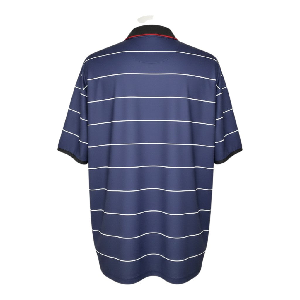 Hinchas Sportswear Store: Manchester United 1999-00 retro away jersey in navy blue with white pinstripes and black polo collar.