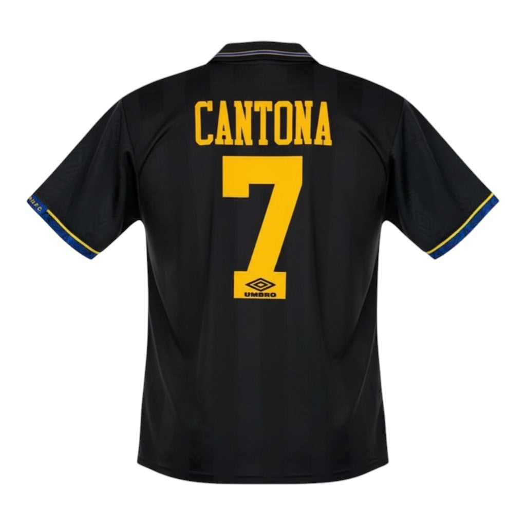 Hinchas Sportswear Store Manchester United 93-95 Cantona away jersey, black with yellow numbering and blue trim.