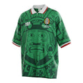 Hinchas Sportswear Store green Mexico 1998 ABA Sport football jersey with Aztec graphic, white polo collar, and tricolor cuffs.