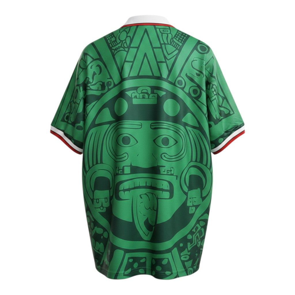 Hinchas Sportswear Store Mexico 1998 green football jersey with large Aztec graphic, white polo collar, and tricolor cuffs.