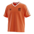 Hinchas Sportswear Store orange Adidas Netherlands 1986 retro football jersey with white V-neck and sleeve stripes.