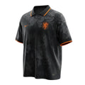 Hinchas Sportswear Store Netherlands black grunge away jersey with orange collar and cuffs, featuring KNVB crest and Nike Swoosh.