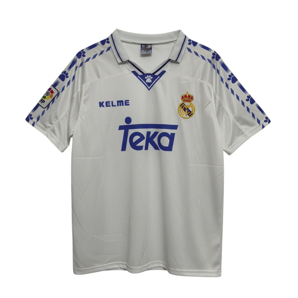 Hinchas Sportswear Store Real Madrid 1996-97 retro white football jersey with blue trim and paw print detail.